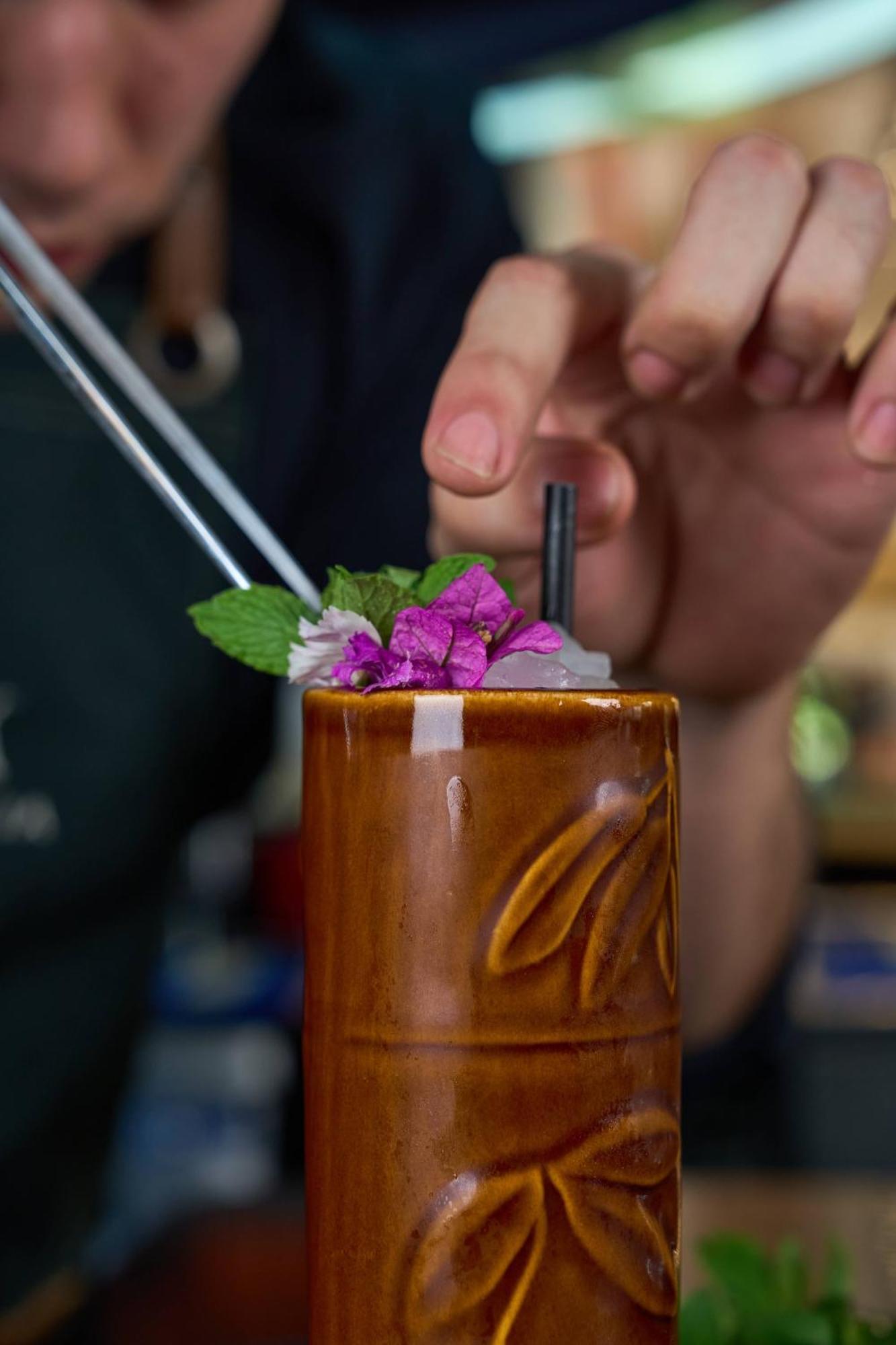 Pullman Santiago Vitacura Exterior photo A tiki drink being garnished