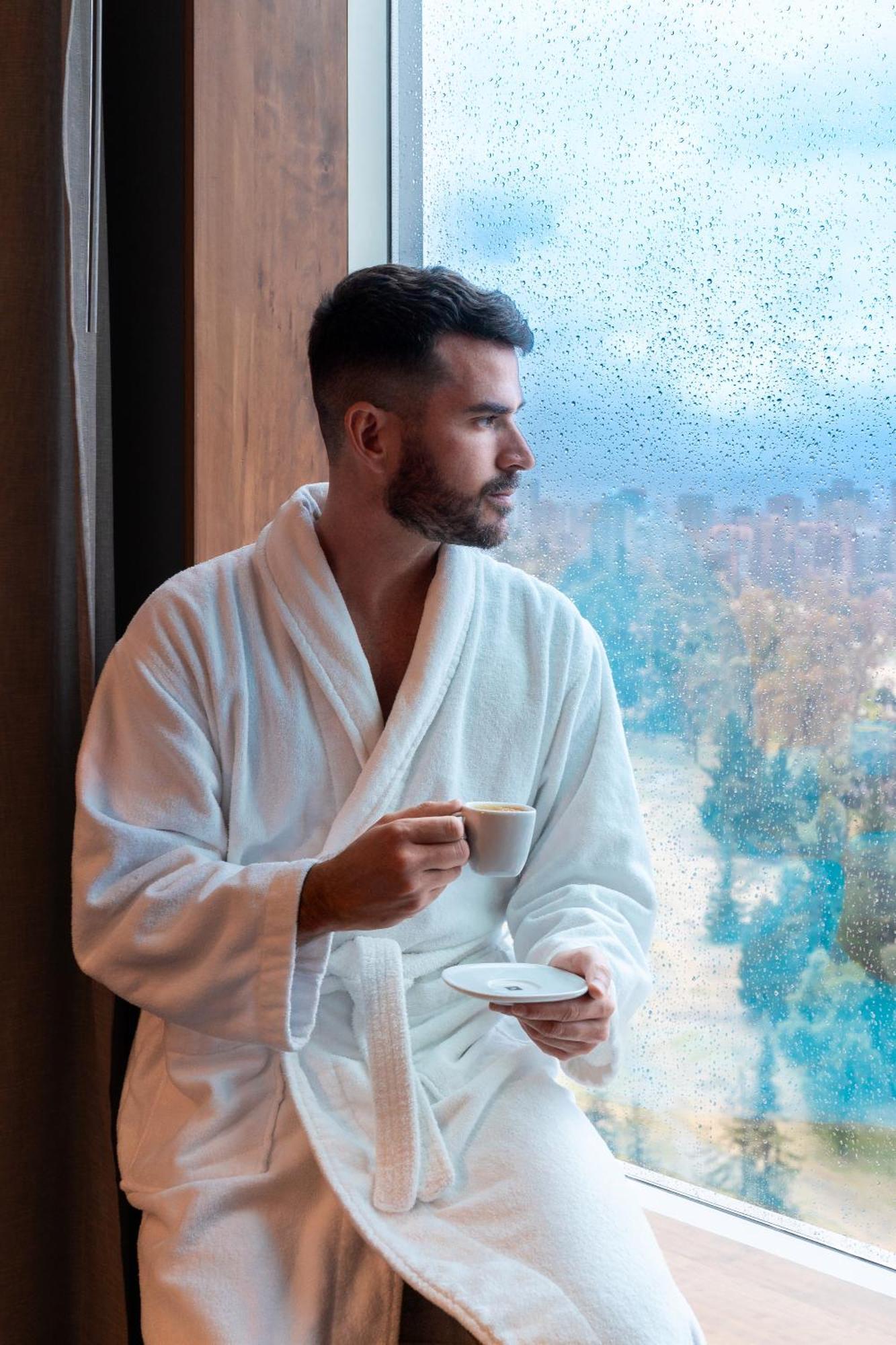 Pullman Santiago Vitacura Exterior photo A man wearing a bathrobe